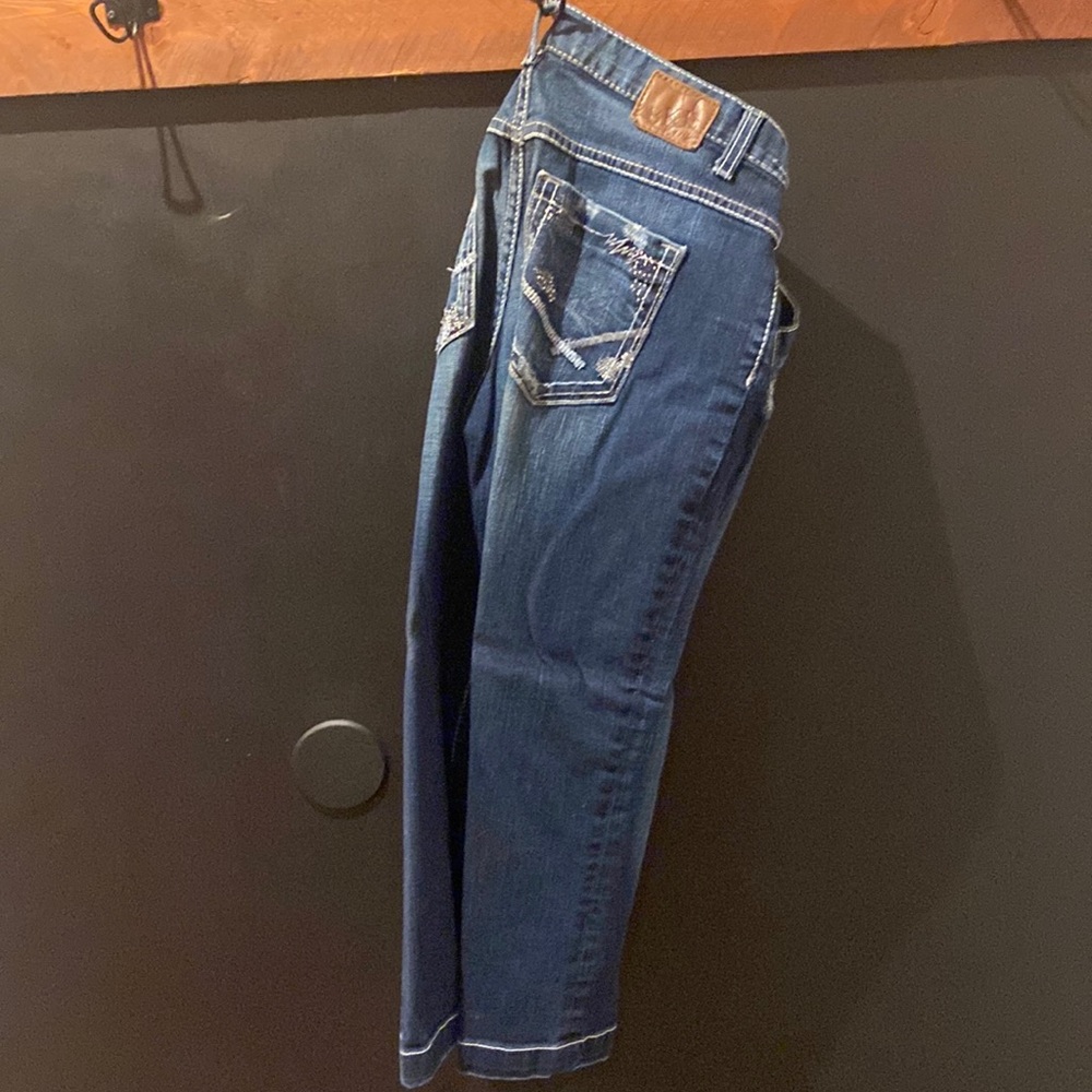 BKE size 29, dark wash capris. With bling on back pockets